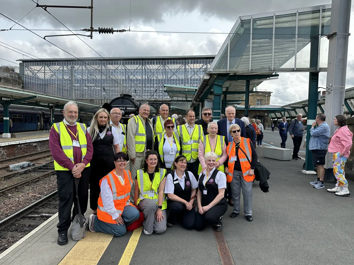 The Settle Carlisle Railway Development Company team pictured in Carlisle on the May 31 charter train from Bradford with the Tornado steam train