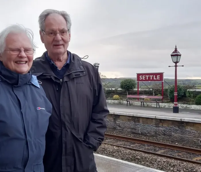 Wendy and Ernest stood at Settle Station